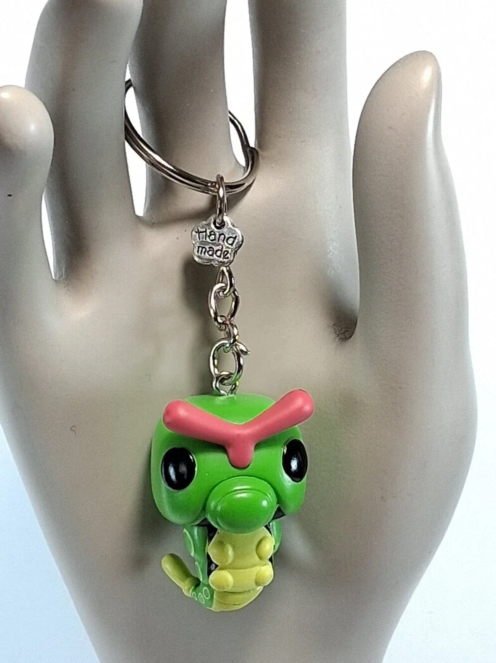 Repurposed Green and Yellow Caterpie Toy Into A Keychain